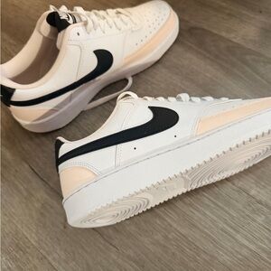 Nike White Sneakers with Black Logo and Light Beige Accents